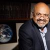 Atul Jain in front of the picture of the earth