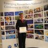Erin Dady shows her award